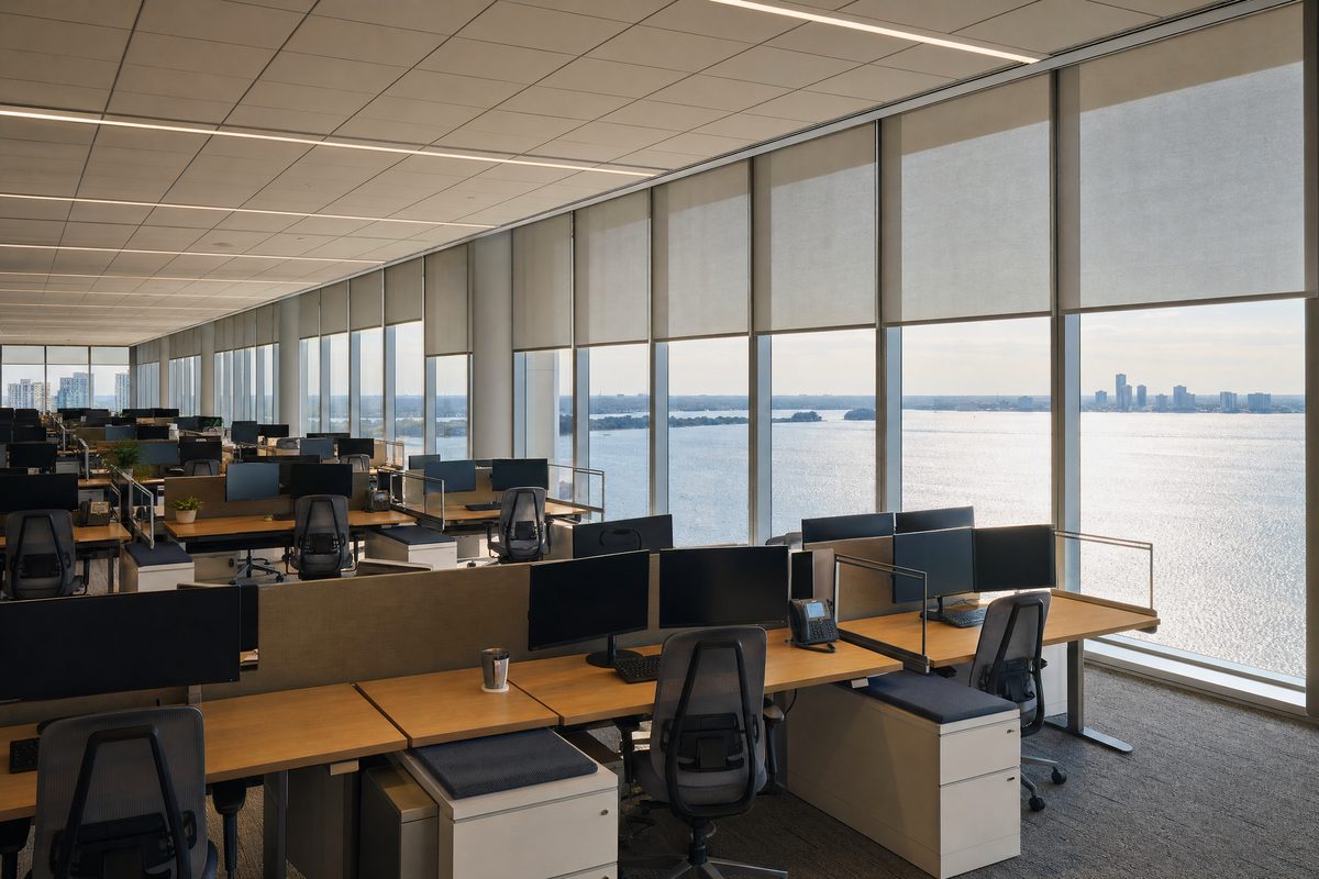 Commercial solar shade installation across an entire floor of a Tampa Bay waterfront office building