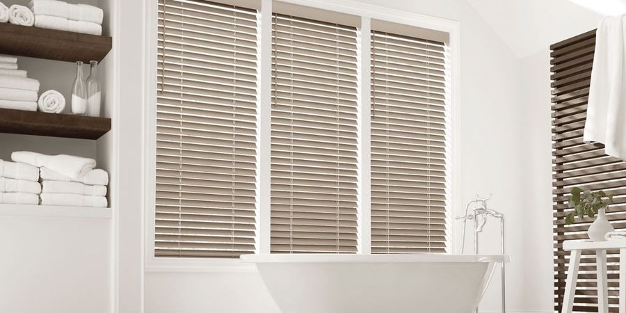 Hunter Douglas EverWood faux wood horizontal blinds in a bright Florida bathroom